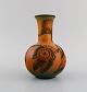 Ipsen's, Denmark. Art nouveau vase in hand-painted ceramics with flowers and foliage in relief. ...