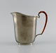 Just Andersen (1884-1943), Denmark. Art deco tin water jug with wicker handle. 1940s. Model ...