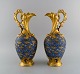 Limoges, Perlam France. Two large jugs in hand-painted porcelain decorated with gold leaf. ...