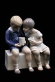 Bing & Grondahl porcelain figure of little boy and girl drinking milk.H:14cm. Decoration ...