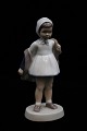 Bing & Grondahl 
porcelain 
figurine of a 
girl with a 
coat. 
Decoration 
number: B&G 
2387. 1.sort. 
...