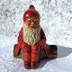 Clay Santa 
Claus on tree 
stump with 
candlestick, 
13cm wide, 14cm 
high *With 
small chips and 
soot ...
