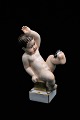 Old Bing & Grondahl porcelain figure in overglaze of a little boy with a fly. Height:15cm. Is ...