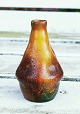 Miniature vase in ceramics from Peter Ipsen's Enke. Designed and glazed in veneer style. Appears ...