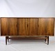 High sideboard in rosewood of Danish design from around the 1960s. A sideboard of high quality, ...