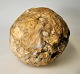 Stone fossil in 
the form of a 
ball. On a foot 
of iron. Dia. 
ball: 13 cm.