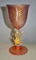 Murano glass 
goblet, 20th 
century Italy. 
Base and goblet 
in clear glass 
with red dust 
and gold. ...