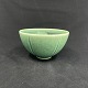 Height 7.3 cm.Diameter 13 cm.Beautiful green-glazed bowl from Saxbo with many fine details ...