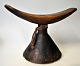 African headrest in wood, early 20th century. With decorations on foot. H.: 15.5 cm. W.: 21.5 cm.
