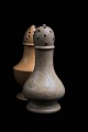 Old salt shaker in cream colored earthenware with a really fine patina. Height:11,5cm.