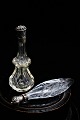 2 antique perfume bottles in glass with silver top. No.1 - standing : Height 11cm. No.2 - ...