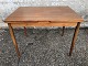 Small dining table in teak veneer with solid teak legs. Danish modern from the 1960s. Appears in ...