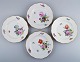 Royal 
Copenhagen 
Sachian Flower. 
Four dinner 
plates with 
hand-painted 
flowers and 
gold ...