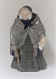 Royal Copenhagen. Porcelain figure. Old lady with cane. Model 784. Height 20 cm. (1 quality). ...