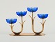 Gunnar Ander for Ystad Metall. Candlestick in brass and blue art glass shaped like flowers. ...