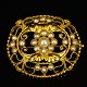 Georg Jensen gold jewellery.Georg Jensen; A big oval brooch made of 18k gold set with pearls. ...