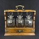 Height 34 cm.Width 36 cm.Exceptionally fine English tantalus with three decanters in cut ...