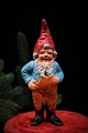 Old terracotta gnome with fine painting and a fine patina. Height:16,5 cm.