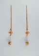 Skultuna, Sweden, a pair of brass candlesticks for wall hanging.Designed by Pierre Forsell. ...