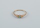 Danish 
goldsmith. 
Modernist 14 
carat gold ring 
adorned with a 
green 
semi-precious 
stone, marked 
...
