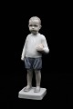 Bing & Grondahl 
porcelain 
figurine of a 
boy with a 
ball. 
Decoration 
number: BG1945. 
2.sort. ...