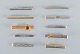 A collection of 
ten Danish tie 
pins in 
sterling silver 
and gold-plated 
metal.
Modernist ...