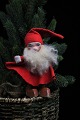 Old Santa Claus 
with beard, 
felt clothes 
and face and 
clogs in 
painted clay. 
Height: 14cm.