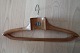 Coat hanger 
made of wood - 
old
Decorative and 
good in use
Text: 
Christian 
Thomsen 
Barnevogne, ...