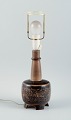 Nils Thorsson, 
b. Eslöv 
(1898-1975). 
Royal 
Copenhagen 
porcelain table 
lamp mounted on 
four ...