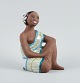Mari Simmulson 
figure.
Rare ceramic 
figure of a 
half-naked 
Tahitian woman. 
...