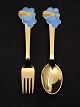 A Michelsen 
Christmas spoon 
and fork 1975 
gold-plated 
sterling silver 
subject no. 
521780