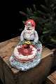 Santa Claus 
with a layer 
cake in painted 
plaster with a 
fine old 
patina. 
He is one of 
several ...