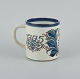 Nils Thorsson 
for Royal 
Copenhagen.
Large 
anniversary mug 
in earthenware. 
1775-1975.
In ...