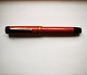Coral red 
President 
fountain pen 
from Ca. 1940. 
In good 
condition. No 
damage or 
repairs. At the 
...