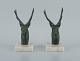 A pair of 
French Art Deco 
bookends. Stags 
in patinated 
metal on a 
marble base.
Approx. ...
