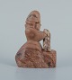 Figurine. 
Skovserkone 
with fish made 
of soapstone.
Approx. 
1960s/70s
In good ...