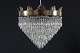 Empire style 
chandelier from 
circa 1910
Metal frame 
with a large 
number
of prisms and 
gold ...