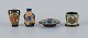 Gouda, Holland, art nouveau hand decorated ceramics.Four miniature vases and bowl.Approx. ...