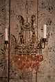 Old French chandelier in gilded metal, decorated with glass chains and glass balls in clear and ...