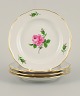 Meissen, 
Germany, four 
plates hand 
painted with 
flowers and 
gold 
decoration.
Approx. ...