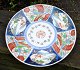 Large Japanese Imari dish, 19th century. Decorated in blue, red, green and gilding. The center ...