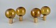 Hans Agne Jakobsson, Sweden, a pair of double wall sconces in brass and smoked ...