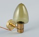Hans Agne Jakobsson, Sweden, a wall sconce in brass and smoked glass.1970s.In good condition ...