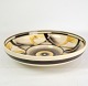 Large 
earthenware 
dish with a 
nice motif in 
yellow, black 
and white 
colors by 
Kiruna.
H:6 Dia:26
