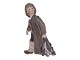 Dahl Jensen figurine, boy holding fish.The factory mark tells, that this was produced ...