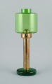 Hans-Agne Jakobsson (1919-2009), table lamp in green glass and brass for candles.1970s.In ...