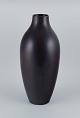 Carl Harry 
Stålhane for 
Rörstrand, 
colossal 
ceramic floor 
vase with glaze 
in brown tones.
Mid ...