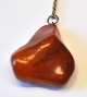 Polished amber necklace with silver chain, Denmark. 4 x 3.8 cm. Chain length: 44 cm.