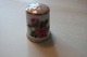 Old thimbles 
made op  
porcelain
Decoration 
with a rose
An the top is 
the decoration 
made like ...