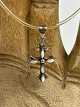 Vintage silver cross with transparent natural rubber "chain" and silver clasp. The cross ...